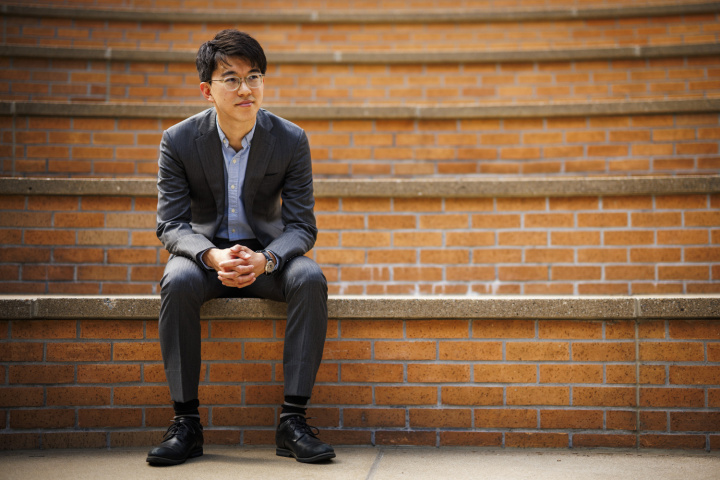 Professor Naoki Egami sitting on steps