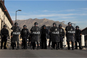 U.S. riot police officers take part in a border security drill at the U.S.-Mexico international bridge, as seen from Ciudad Juárez, Mexico, on Monday. (AFP/Getty Images)