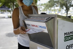 Woman carrying voting box