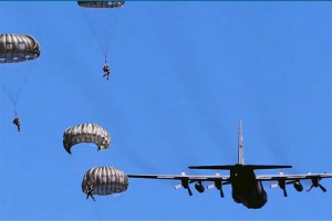 C-130 Hercules aircraft and parachutists