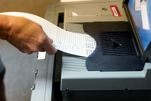 inserting ballot into a ballot machine