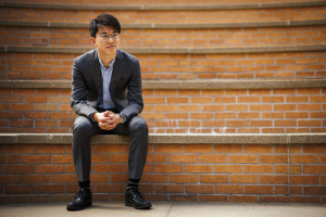 Professor Naoki Egami sitting on steps